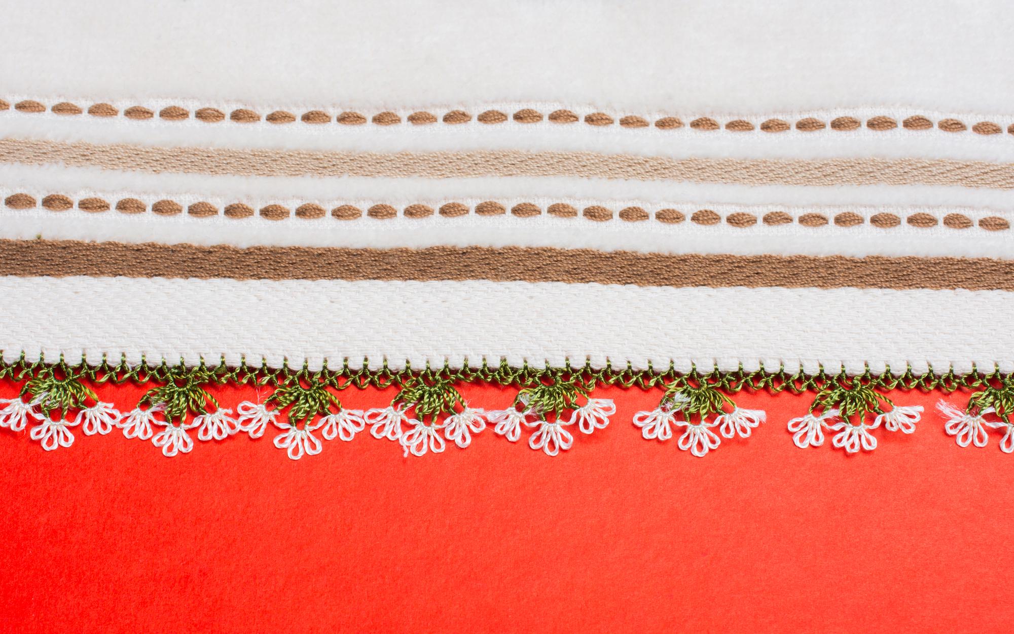 Hand-finishing of embroidered edge